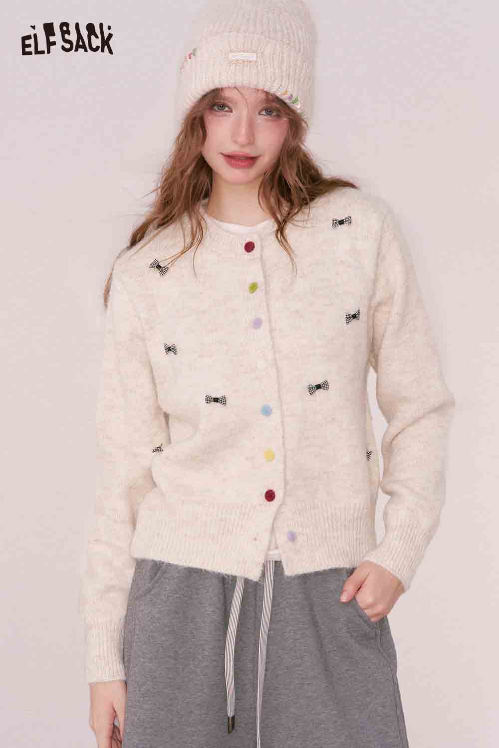 ELFSACK girly bow cardigan in cream with colorful bow embellishments and a cozy fit