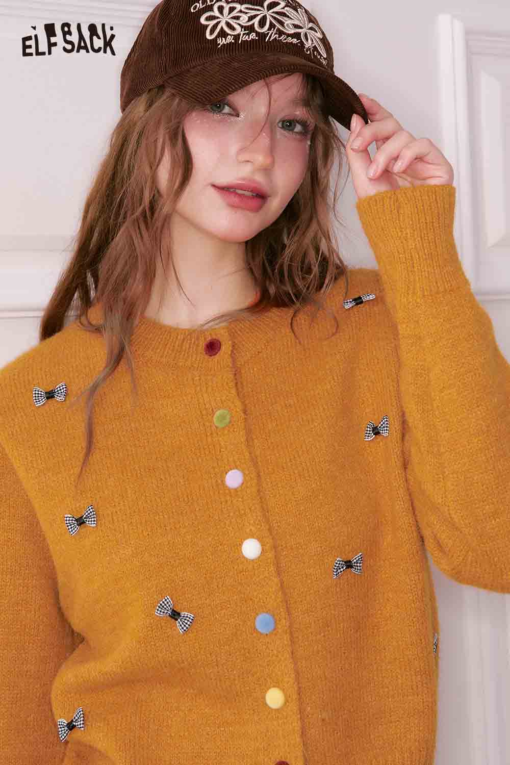 ELFSACK girly bow cardigan in mustard yellow with colorful buttons and bow details