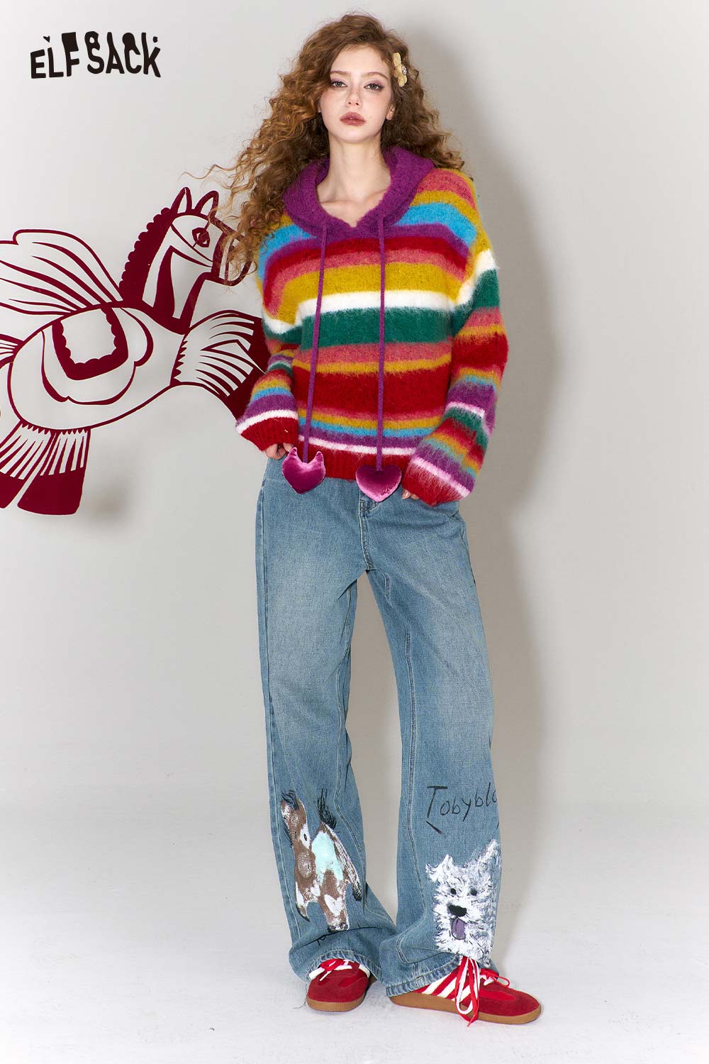 ELFSACK graffiti animal print wide leg jeans paired with a colorful striped hoodie