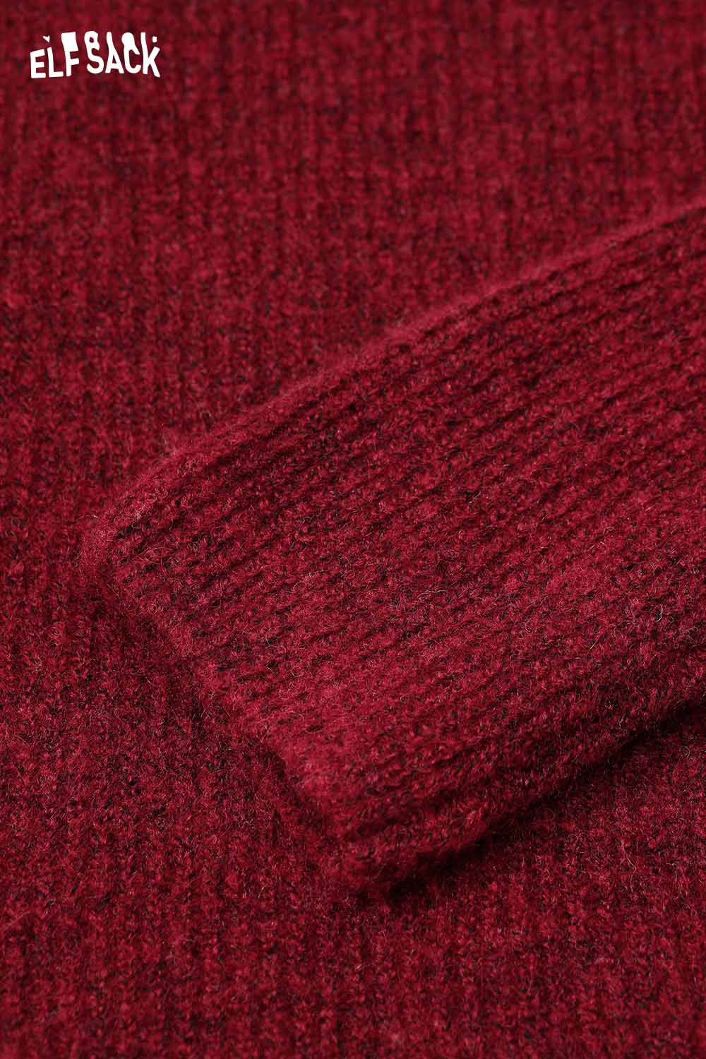 Close-up of ELFSACK Halloween knitted long sleeve top in rich red texture