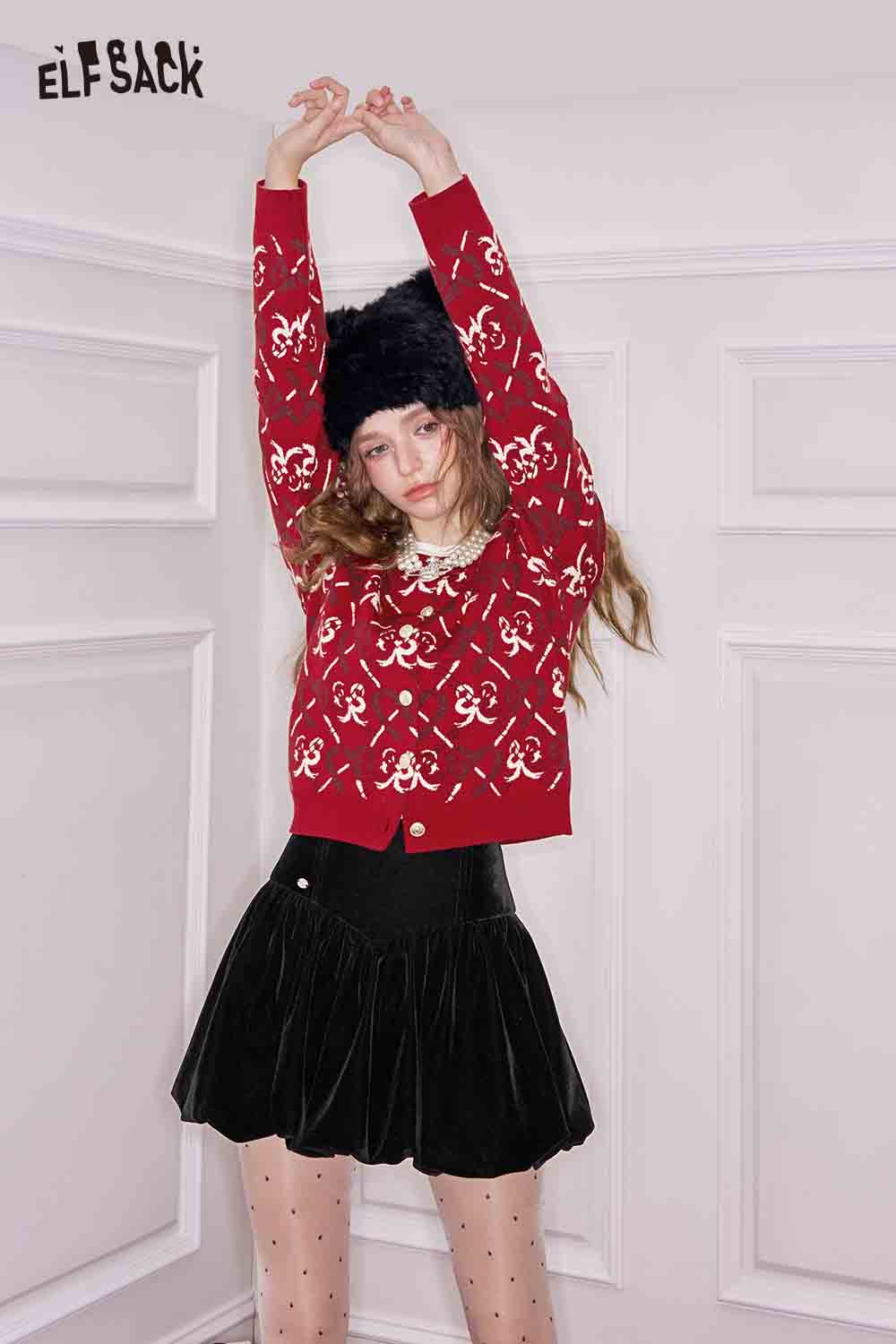 ELFSACK heart bow print cardigan in red with a stylish design, paired with a black skirt and polka dot tights