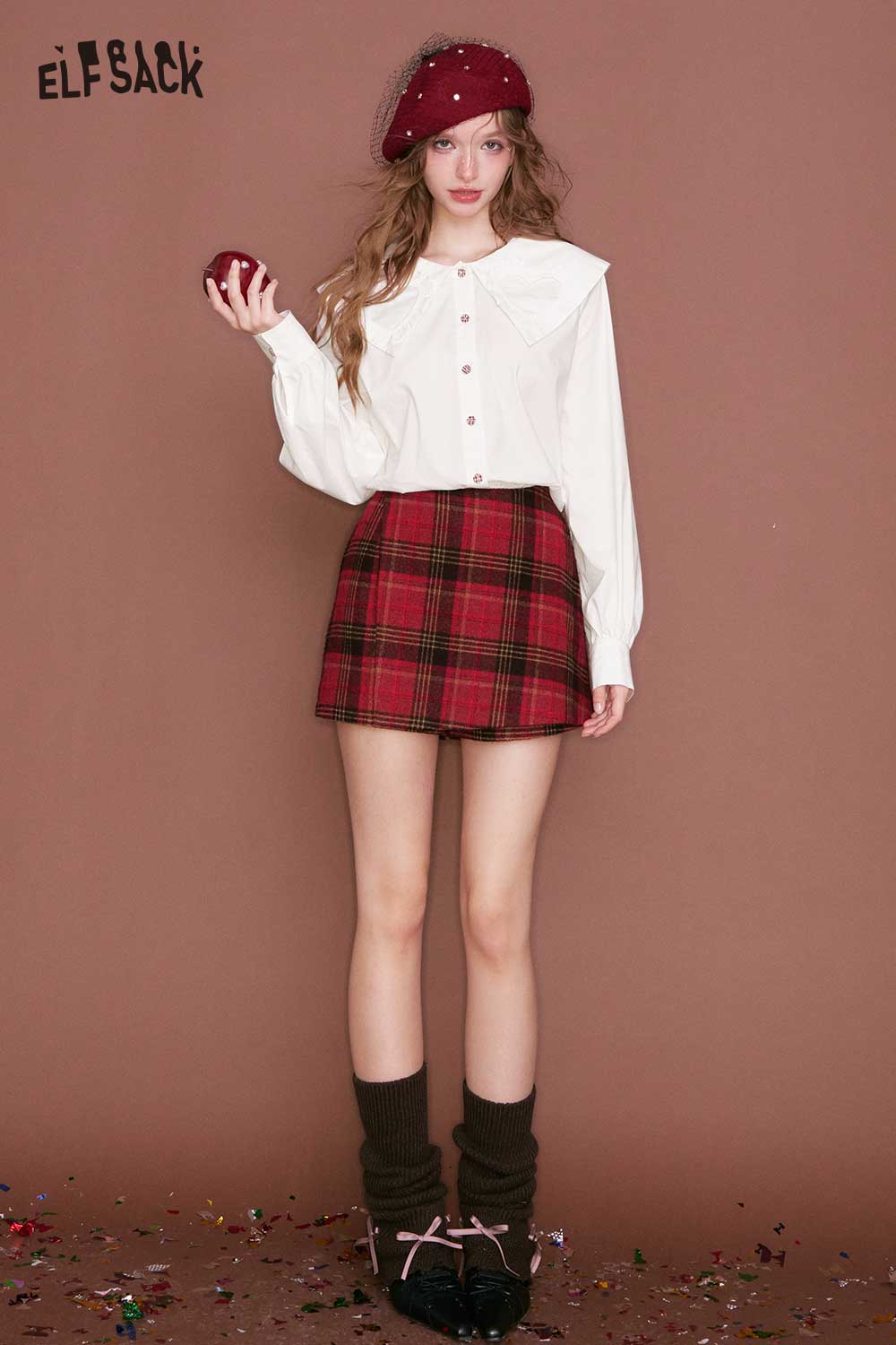 White ELFSACK heart collar blouse for women worn with a plaid skirt, ideal for stylish casual outfits
