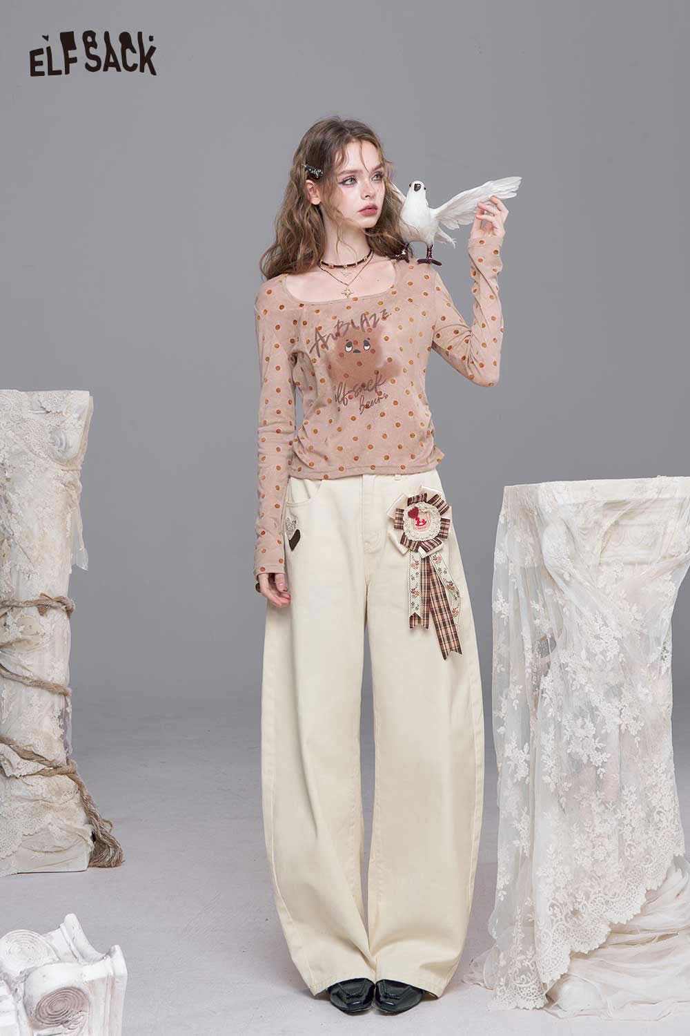 ELFSACK heart embroidery white wide leg jeans styled with a sheer polka dot top for a trendy look