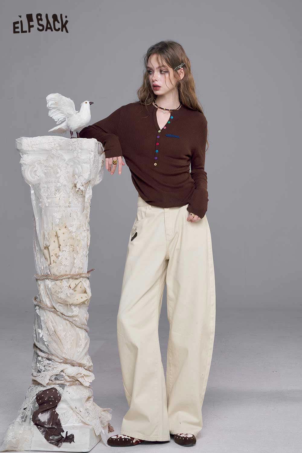 ELFSACK heart embroidery white wide leg jeans paired with a stylish brown cardigan