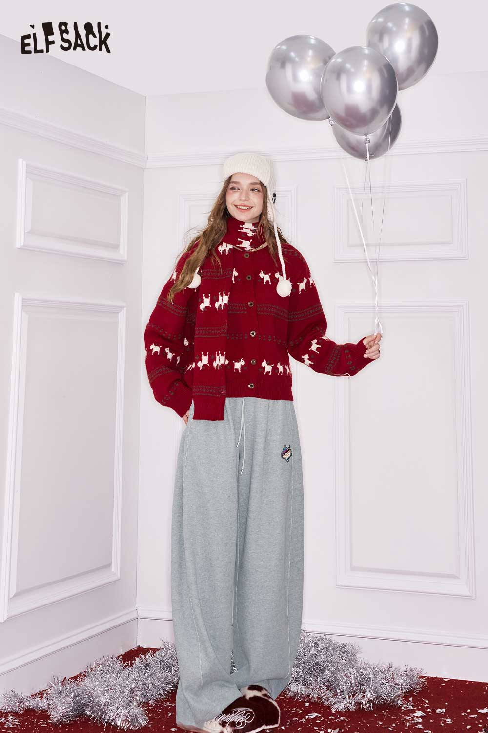 ELFSACK heart embroidery wide leg pants in light grey paired with a red festive sweater