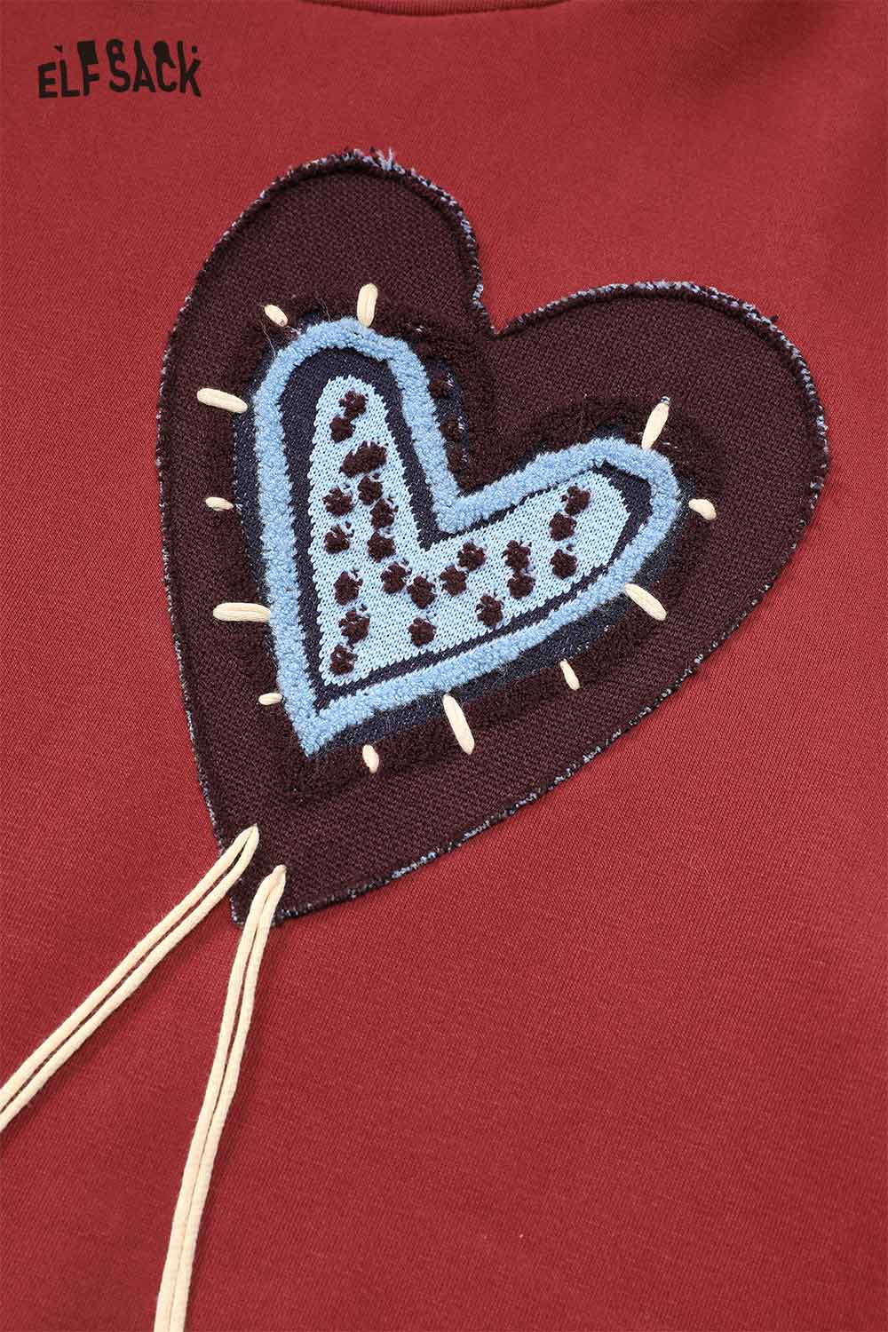 ELFSACK heart graphic collared sweatshirt with a colorful heart design on a burgundy background