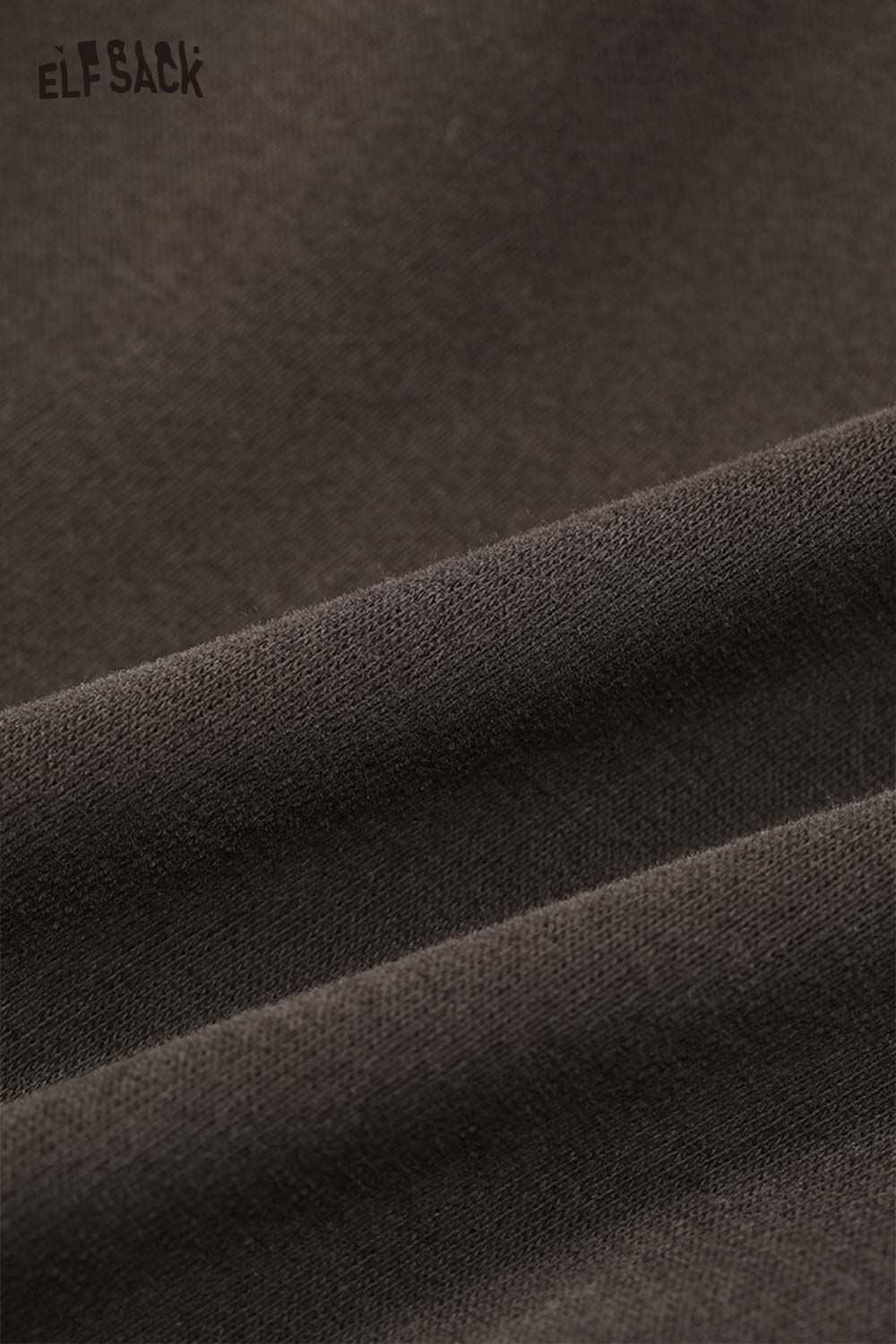 Close-up of soft fabric texture showcasing the heart patchwork hooded sweatshirt from ELFSACK