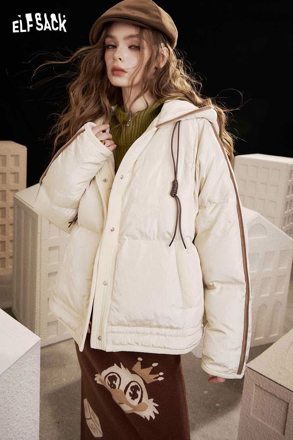 ELFSACK heart print knit sweater paired with a stylish jacket for a cozy winter look