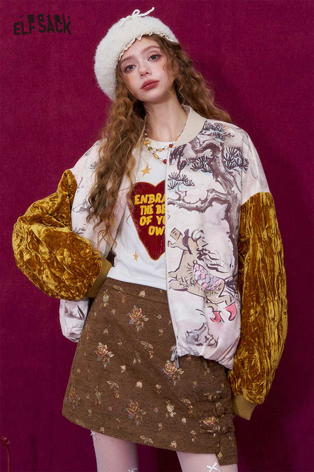 ELFSACK heart print long sleeve t-shirt styled with a colorful bomber jacket and a patterned skirt