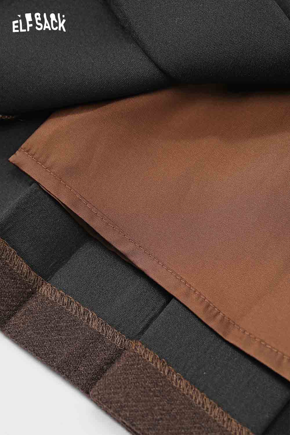 ELFSACK high-rise button front pleated skirt showing detailed fabric layers and stitching