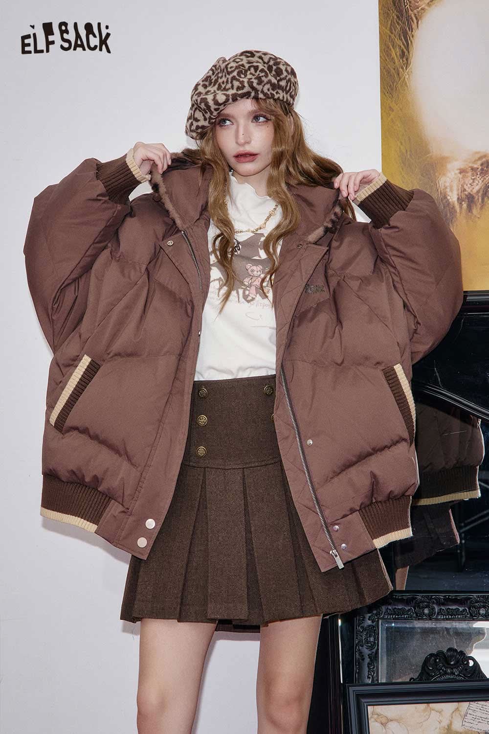ELFSACK high-rise button front pleated skirt styled with a brown puffer jacket and beret