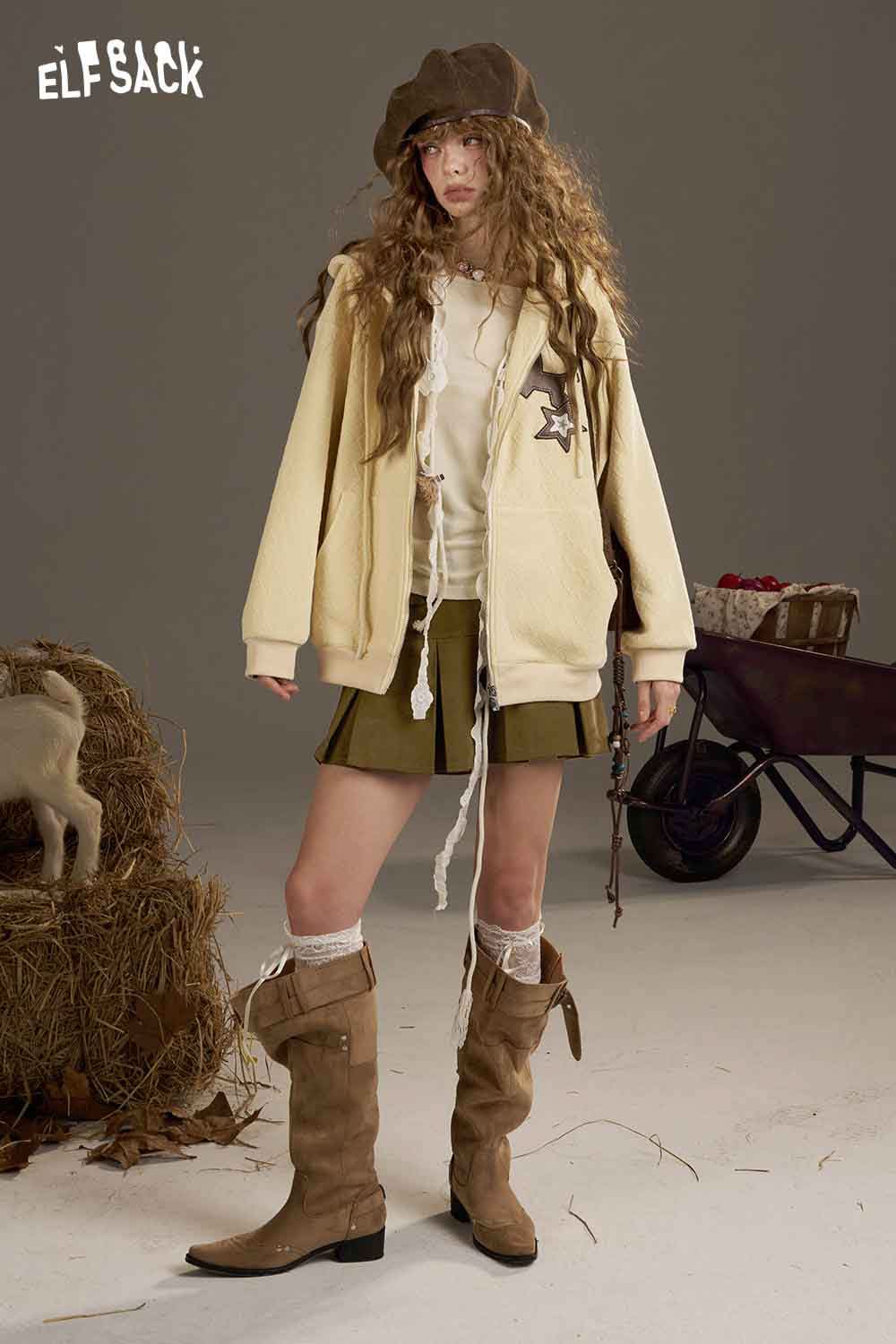ELFSACK high waist pleated skirt styled with a cozy hoodie and knee-high boots for a trendy look