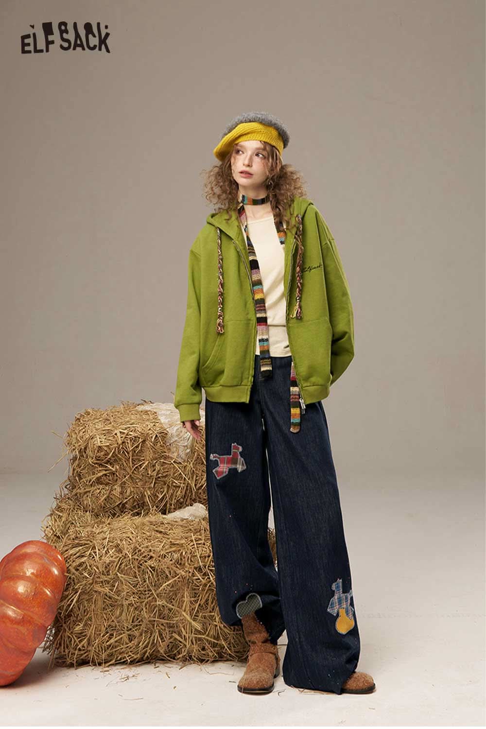ELFSACK high waisted wide leg denim pants styled with a green jacket and matching accessories