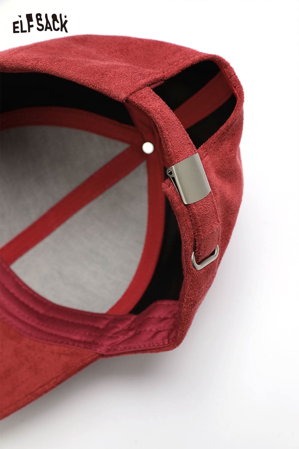 Inside view of ELFSACK suede baseball cap showing adjustable strap and soft lining for comfort