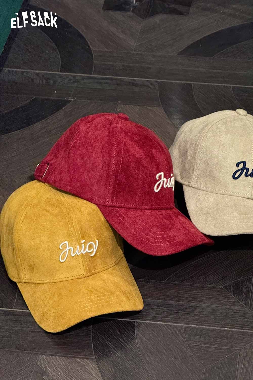 Colorful suede baseball cap set featuring red, yellow, and beige designs with embroidered details