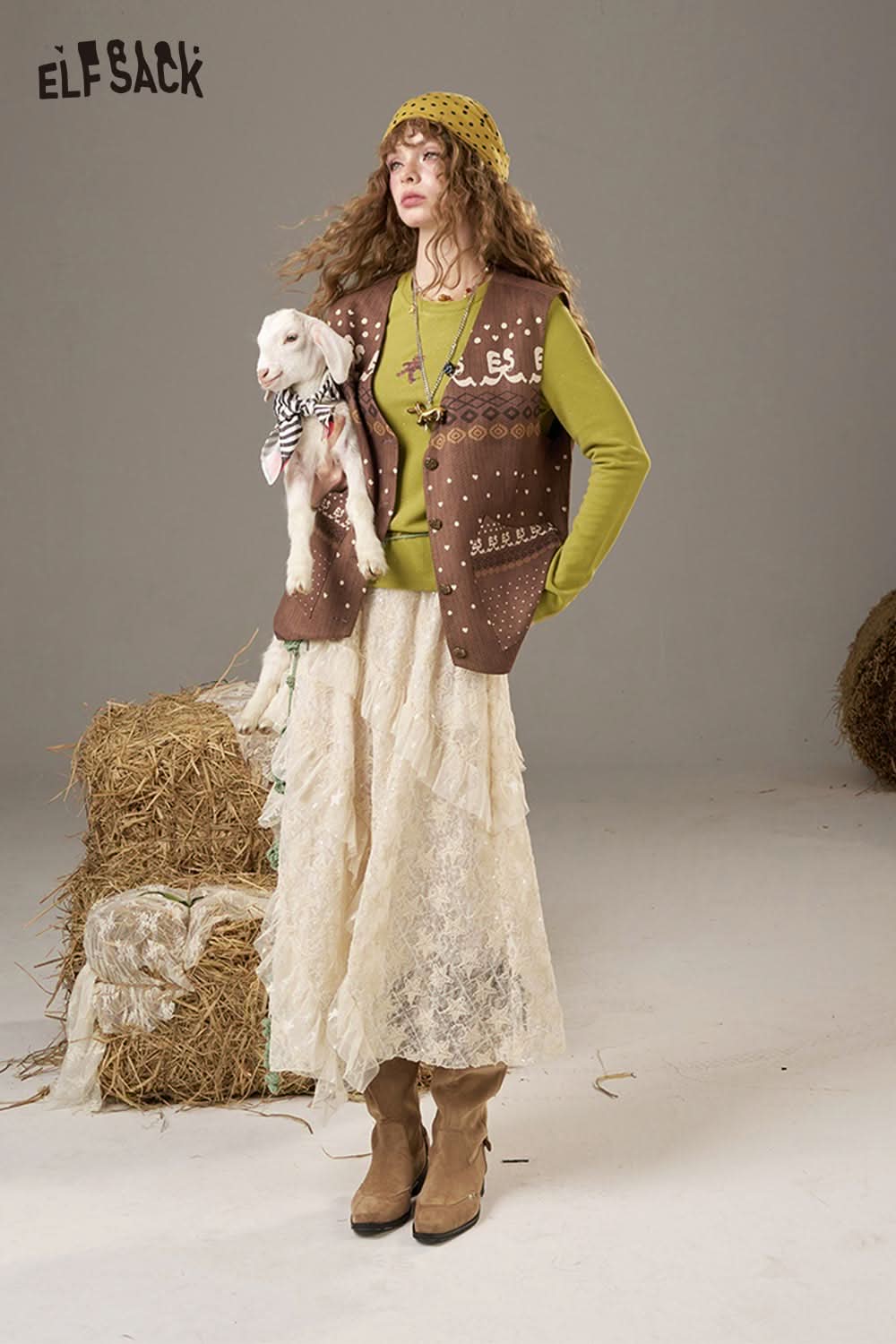 ELFSACK Lace Patchwork Long Skirt Styled with a Brown Vest and Beige Sweater for a Cozy Look