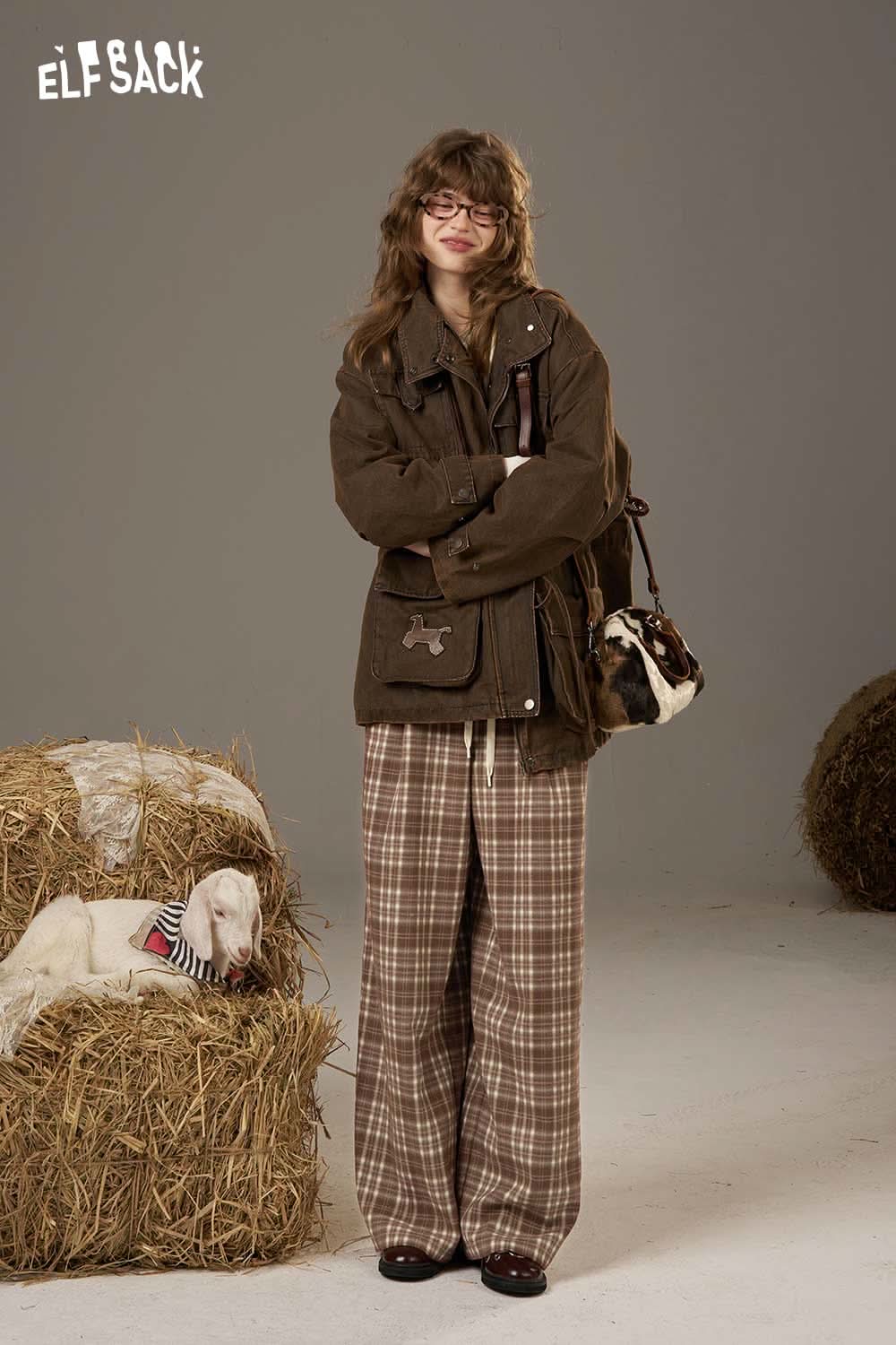 Model wearing ELFSACK lace plaid straight leg pants paired with a brown jacket and stylish accessories
