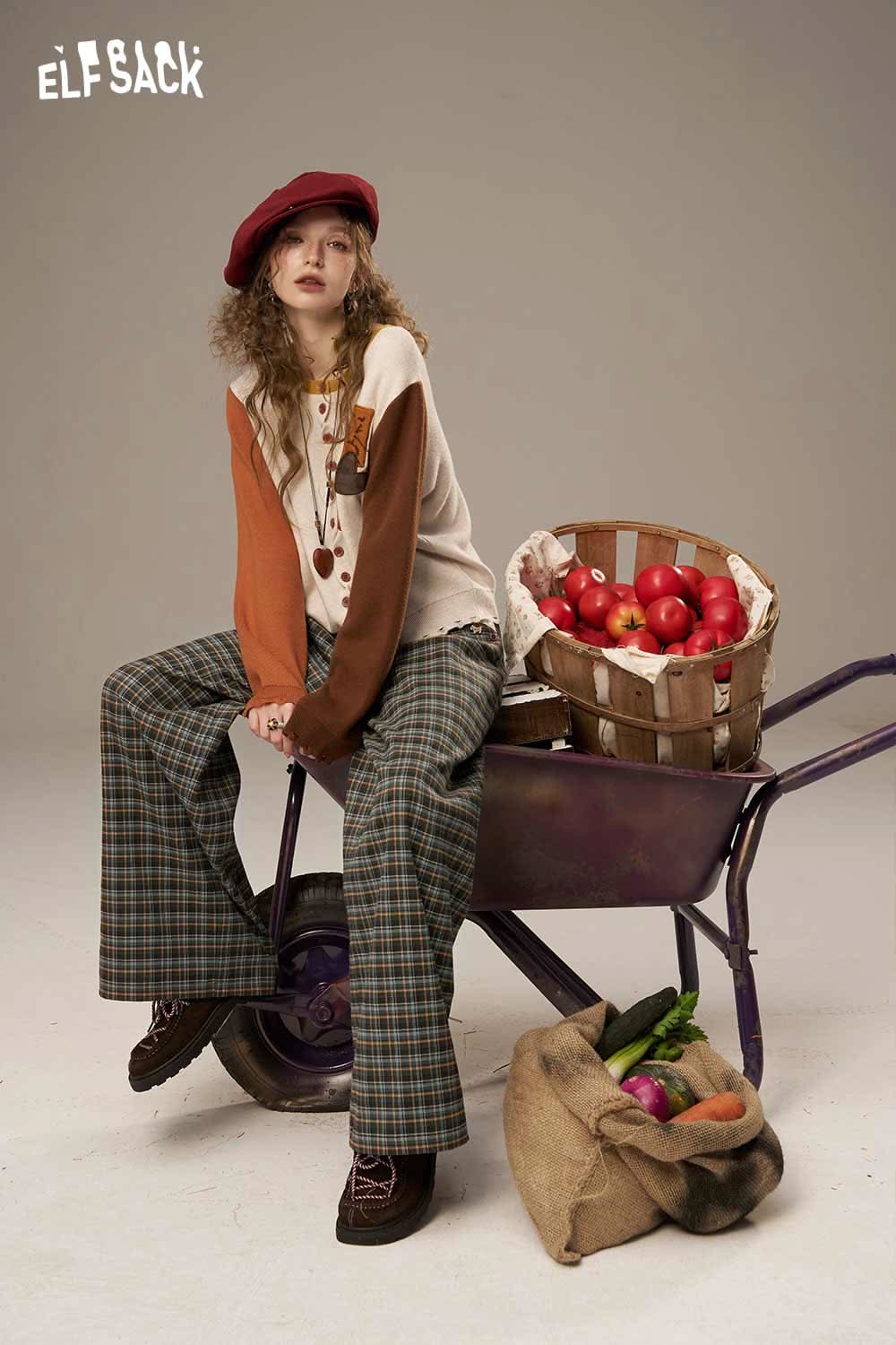 ELFSACK lace plaid straight leg pants styled with a cozy top and a playful beret on a model
