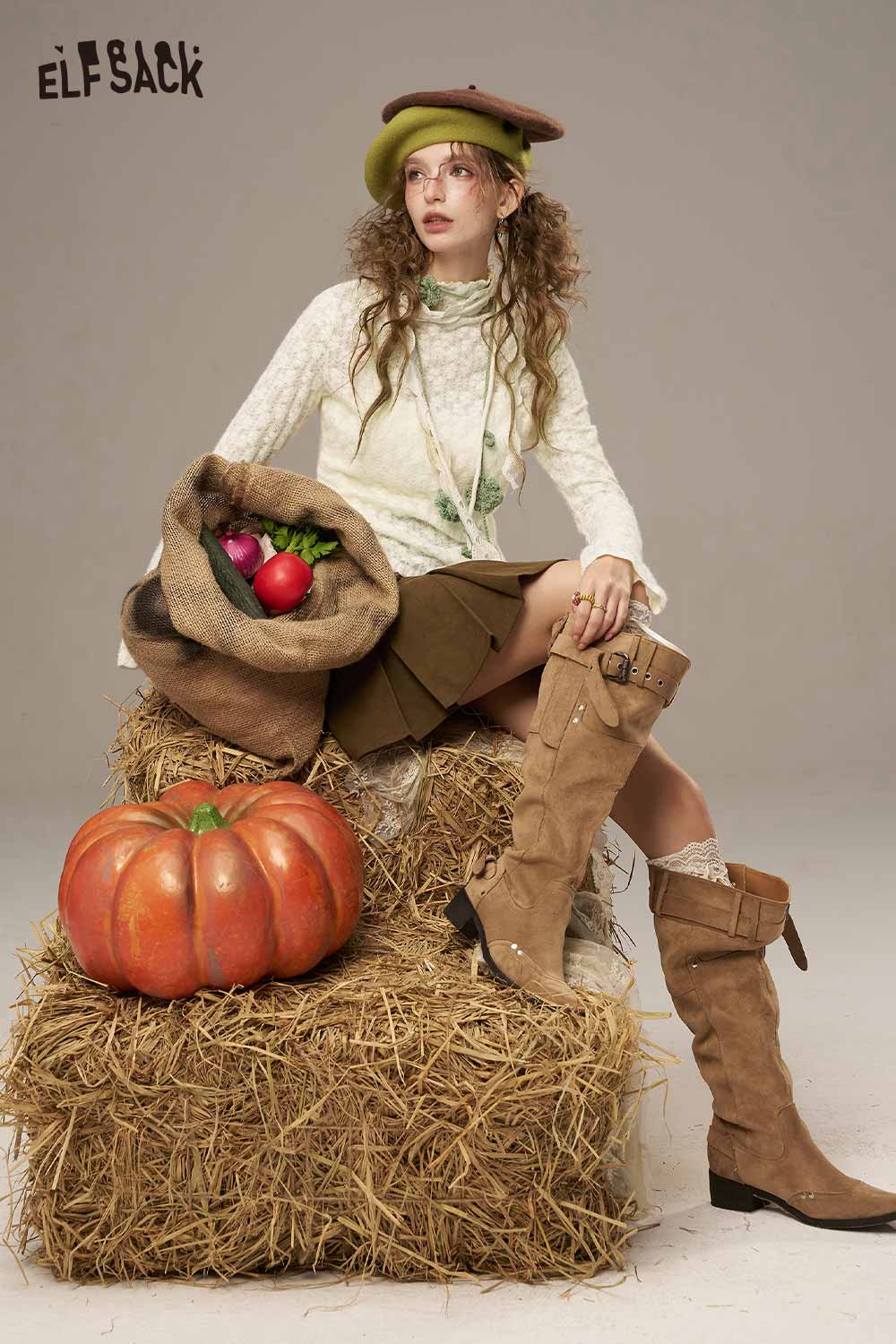 ELFSACK lace slim fit long sleeve shirt styled with a brown skirt and knee-high boots against a hay backdrop