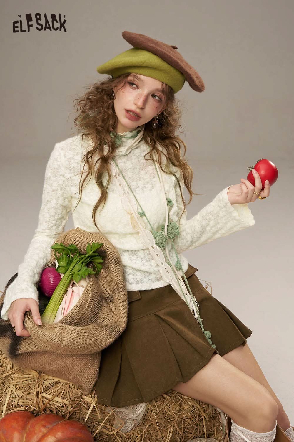 ELFSACK lace slim fit long sleeve shirt styled with a brown skirt and holding an apple and fresh vegetables