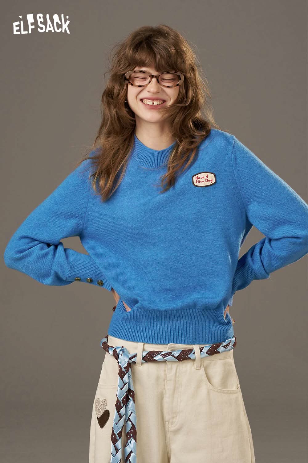 ELFSACK lantern sleeve fitted knitted sweater in blue featuring a round neckline and playful detail