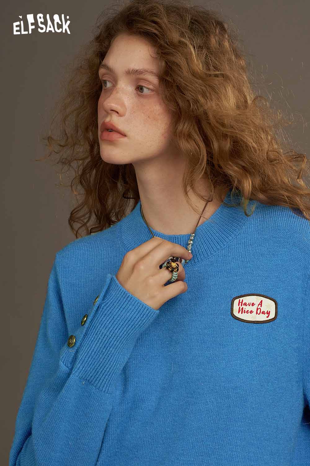 ELFSACK lantern sleeve fitted knitted sweater in blue with decorative button details and patch.
