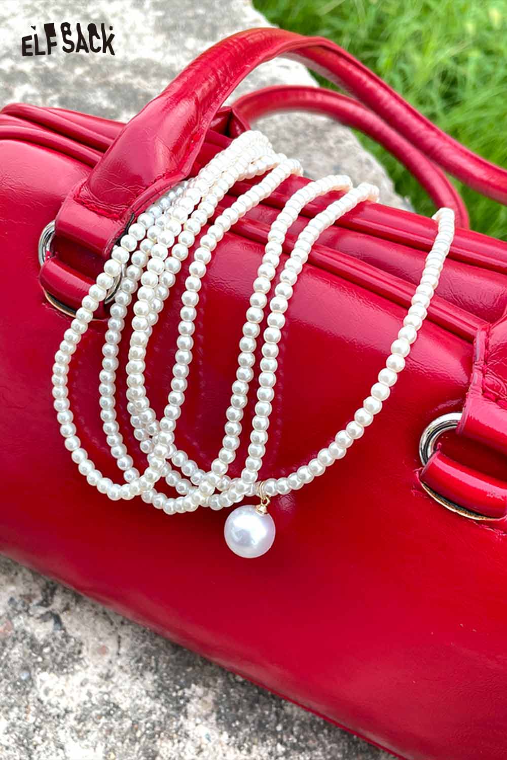 ELFSACK layered pearl choker necklace displayed on a red handbag for a chic accessory look