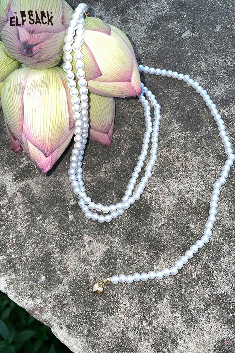ELFSACK layered pearl choker necklace displayed on a lotus flower background for a stylish accessory look