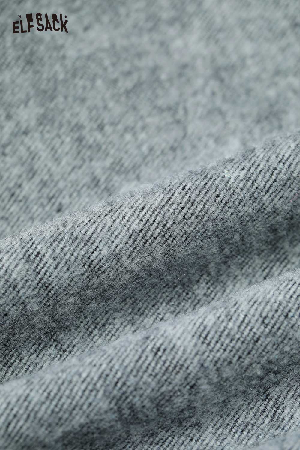Detail view of ELFSACK leaf print floor length jeans showcasing soft fabric texture and design