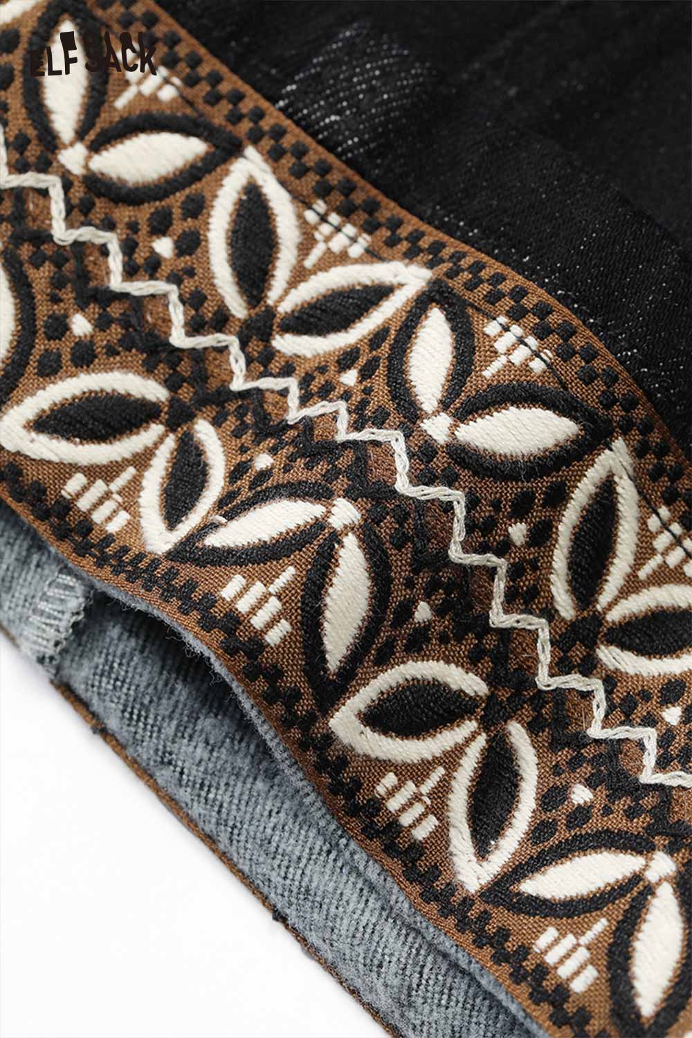 ELFSACK leaf print floor length jeans featuring a stylish patterned waistband and intricate design details