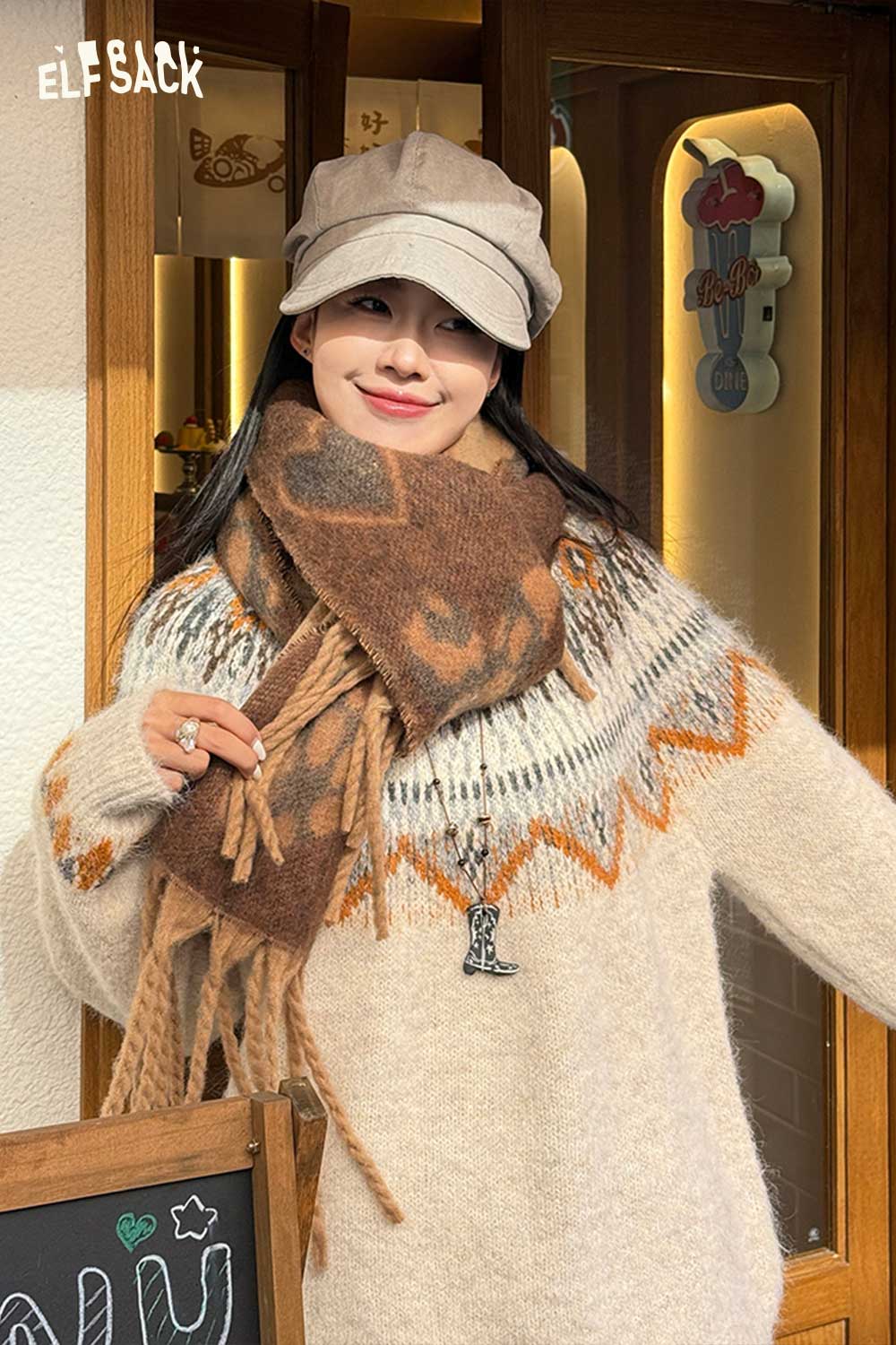 ELFSACK leopard heart fringe scarf styled with a cozy sweater for a fashionable winter look