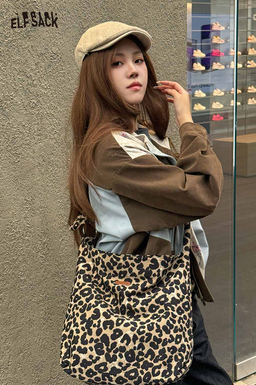 Woman wearing a leopard print crossbody bag paired with a casual outfit and cap
