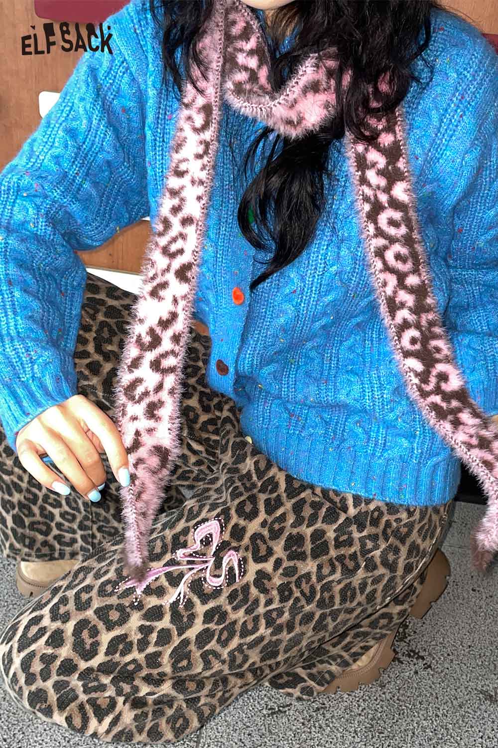 Stylish leopard print fuzzy scarf paired with a blue ELFSACK cardigan and leopard print pants