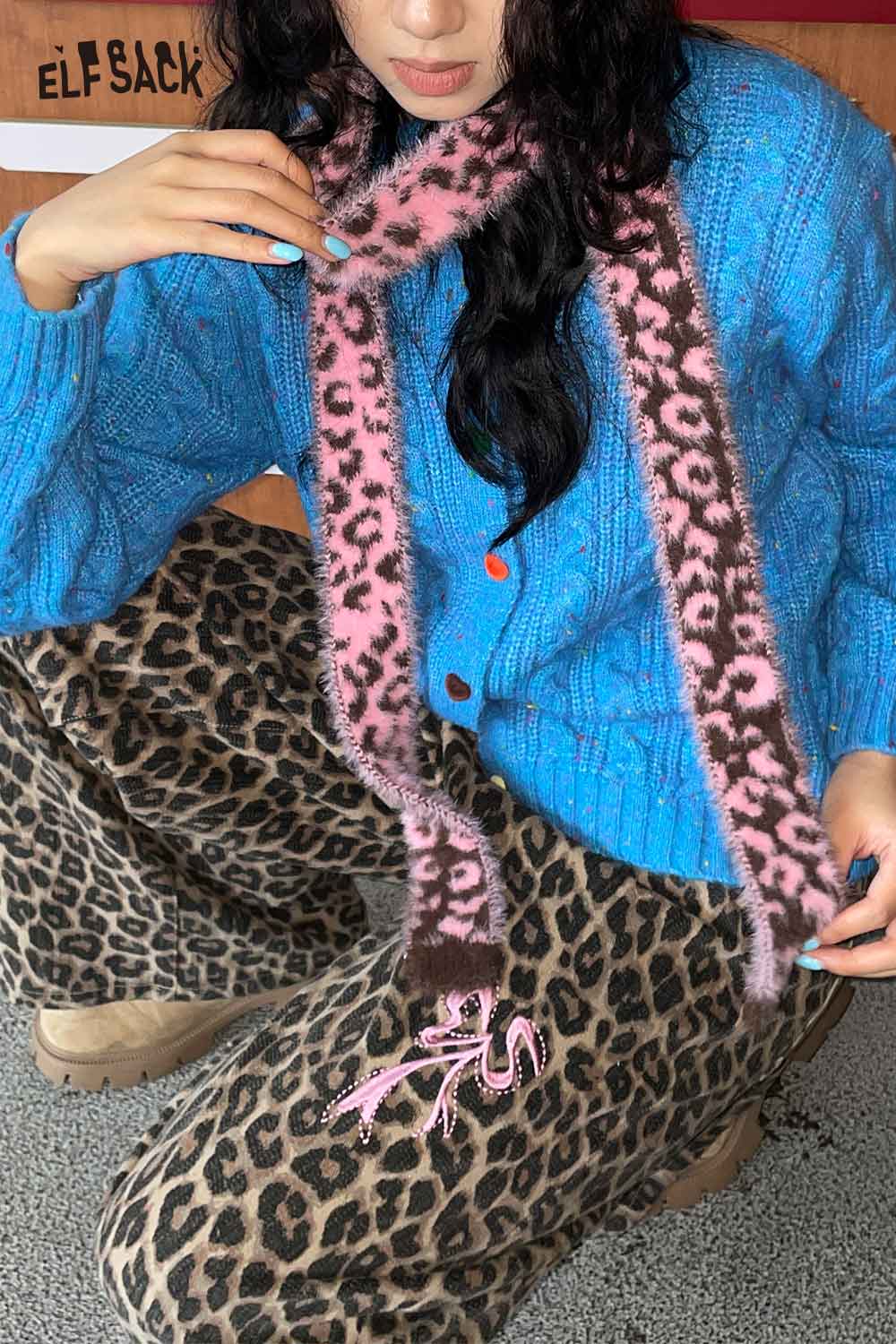 ELFSACK leopard print fuzzy scarf paired with a cozy blue cardigan and leopard print pants