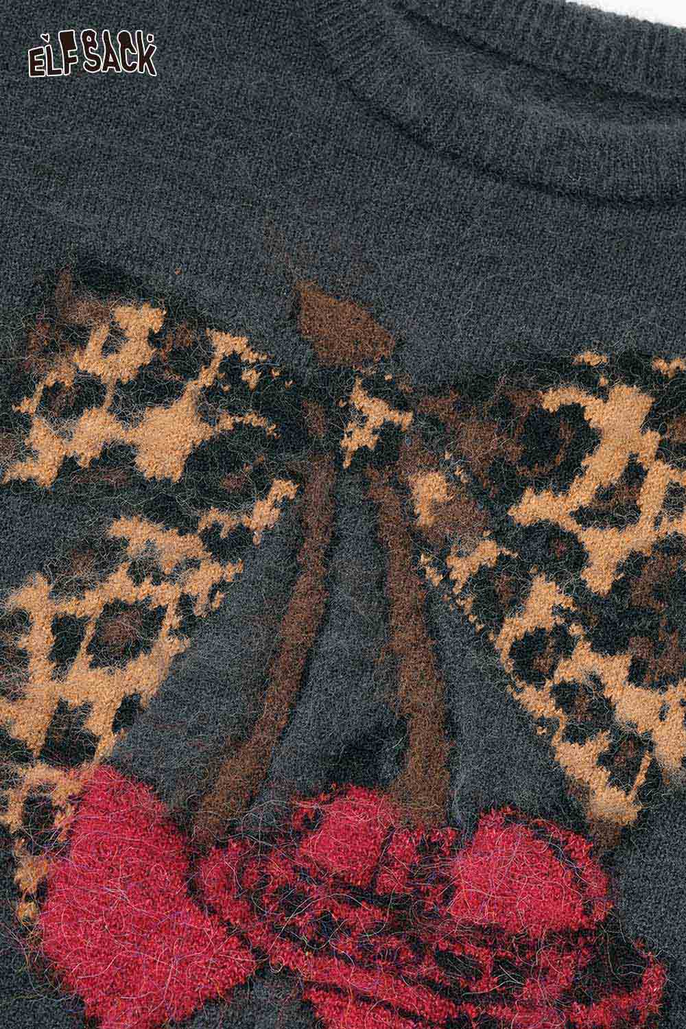 ELFSACK leopard print graphic sweater featuring a colorful design with a butterfly and cherries