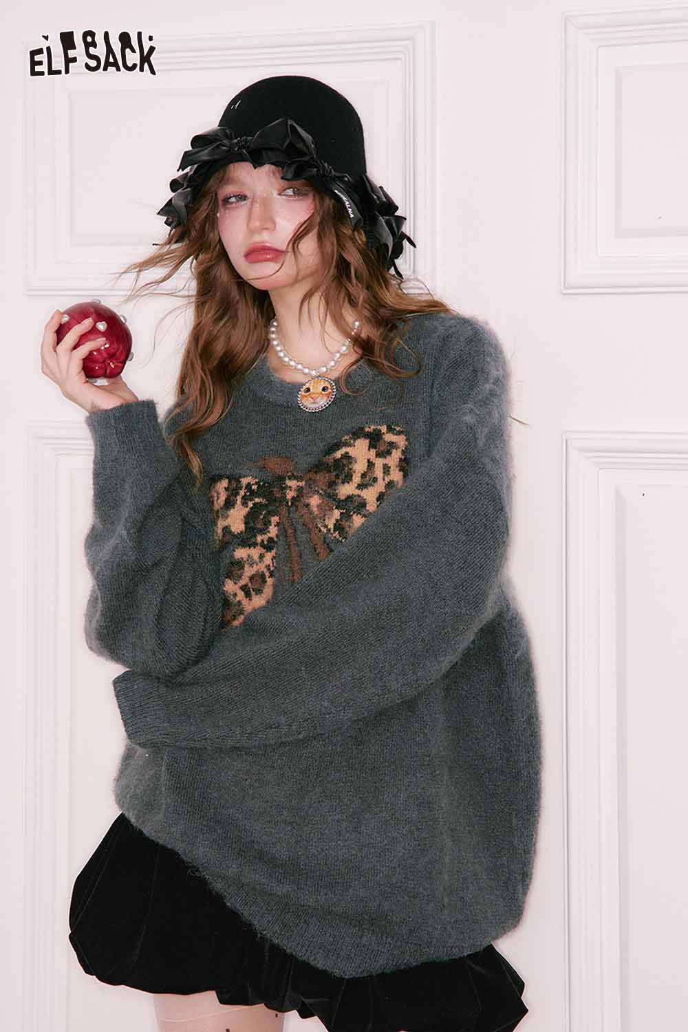 ELFSACK leopard print graphic sweater with oversized fit and bow detail, styled with a black skirt