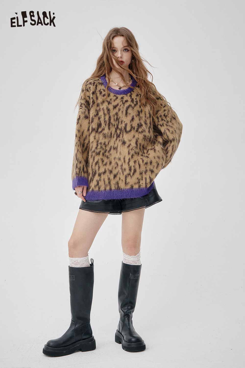 ELFSACK leopard print oversized sweater in brown with purple accents, styled with a black skirt and knee-high boots