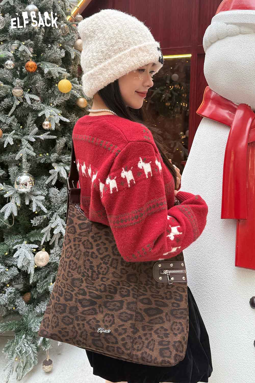 ELFSACK leopard print suede crossbody bag styled with a festive red sweater for winter fashion