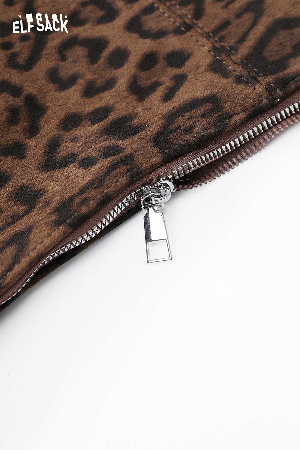 Close-up of ELFSACK leopard print suede crossbody bag featuring a stylish zipper detail