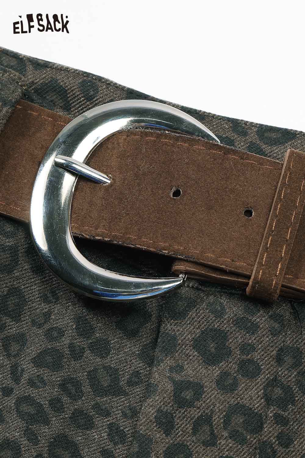 Close-up of ELFSACK leopard print wide leg pants featuring a stylish silver buckle belt