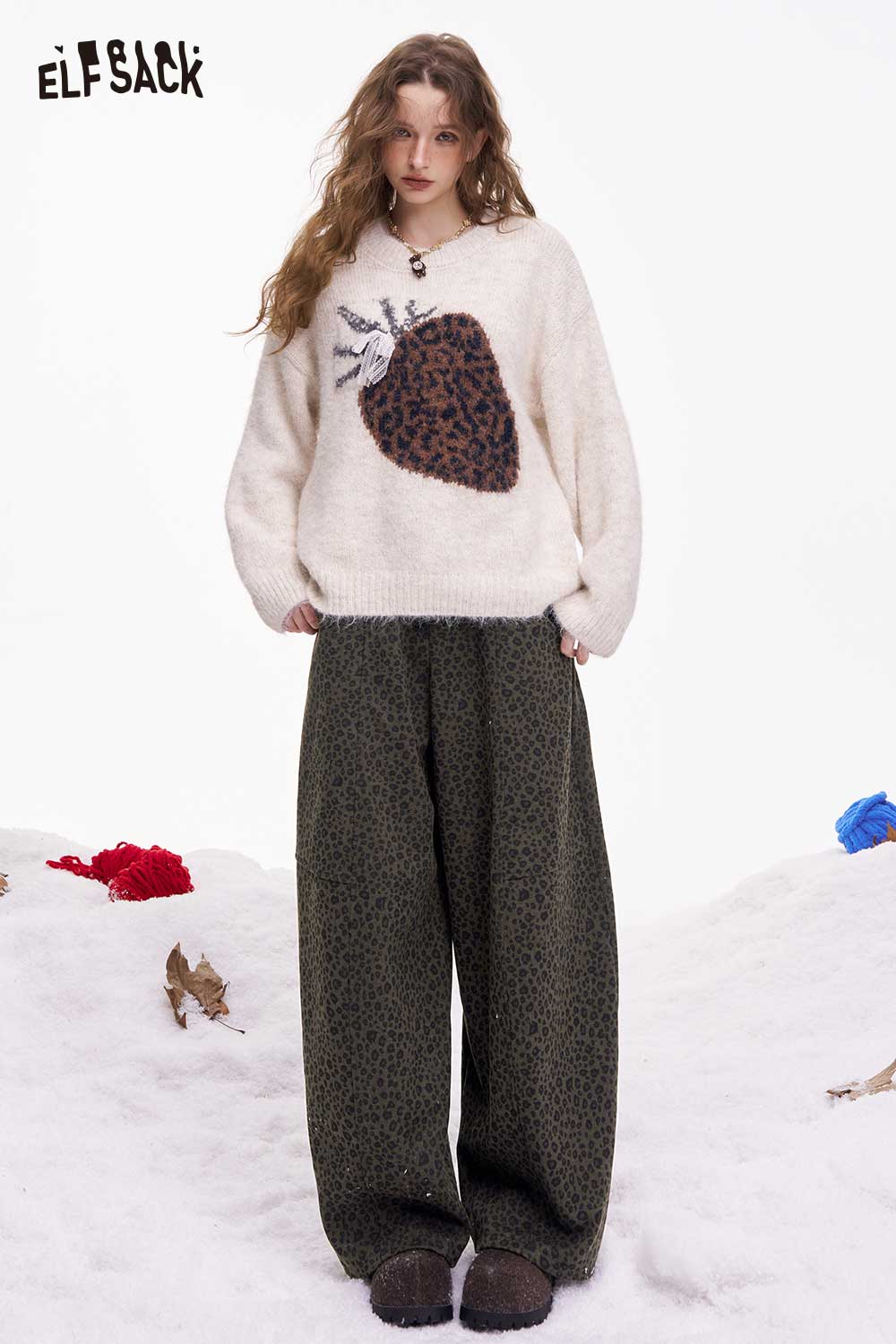 ELFSACK leopard print wide leg pants paired with a cozy sweater for a stylish winter look
