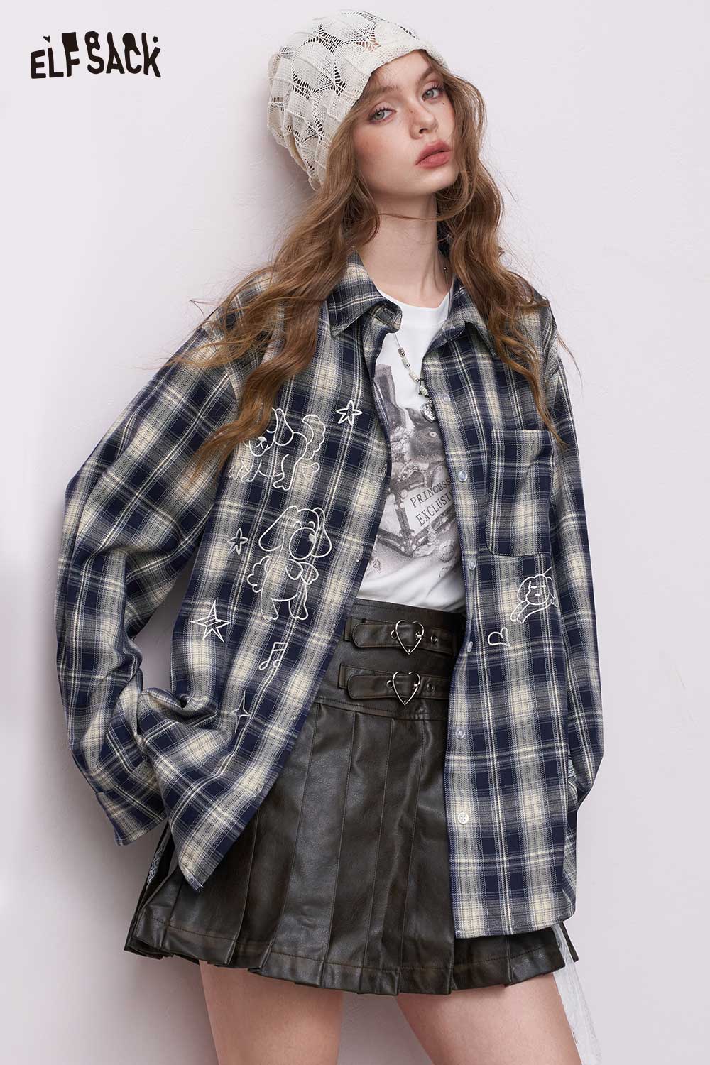 ELFSACK model wearing women's dark blue plaid graphic shirt with embroidered cartoon prints and relaxed fit