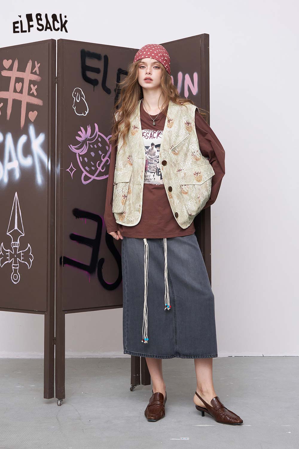 ELFSACK women's graphic lace vest cream floral worn over brown long sleeve tee with denim skirt