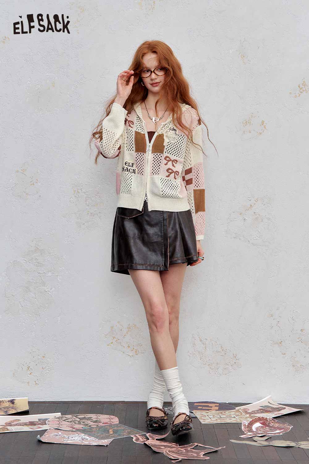 ELFSACK model wearing women's openwork knit zip hoodie cream patchwork with black leather mini skirt and loafers