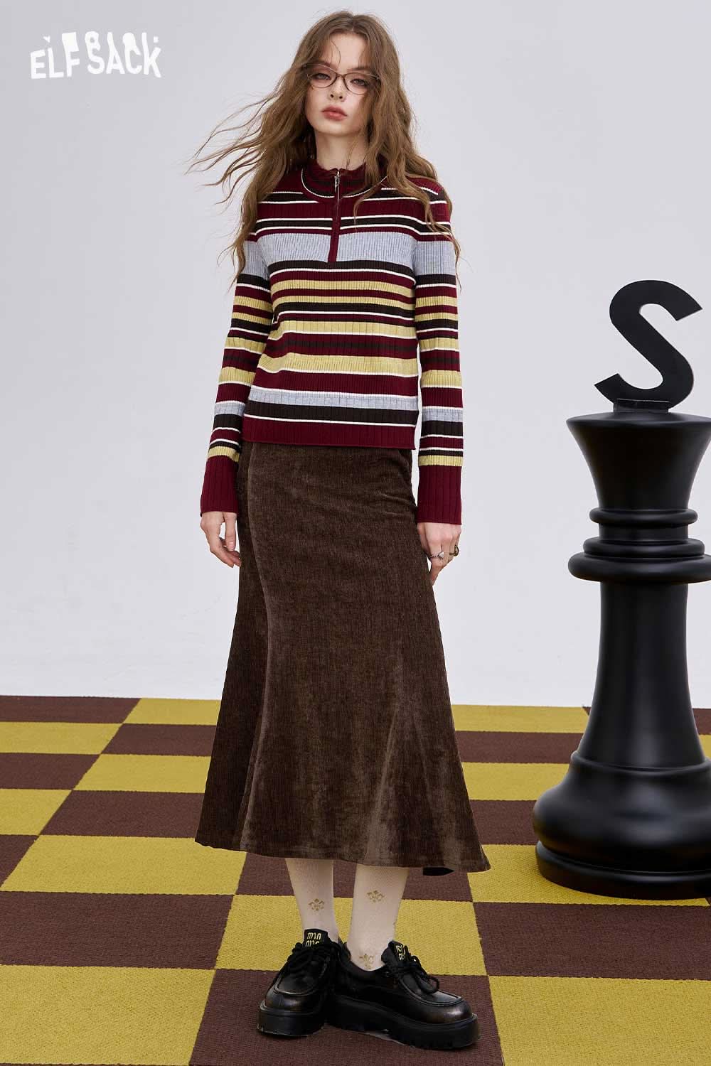 Light slim fit bodycon skirt in brown paired with a striped sweater for a stylish look