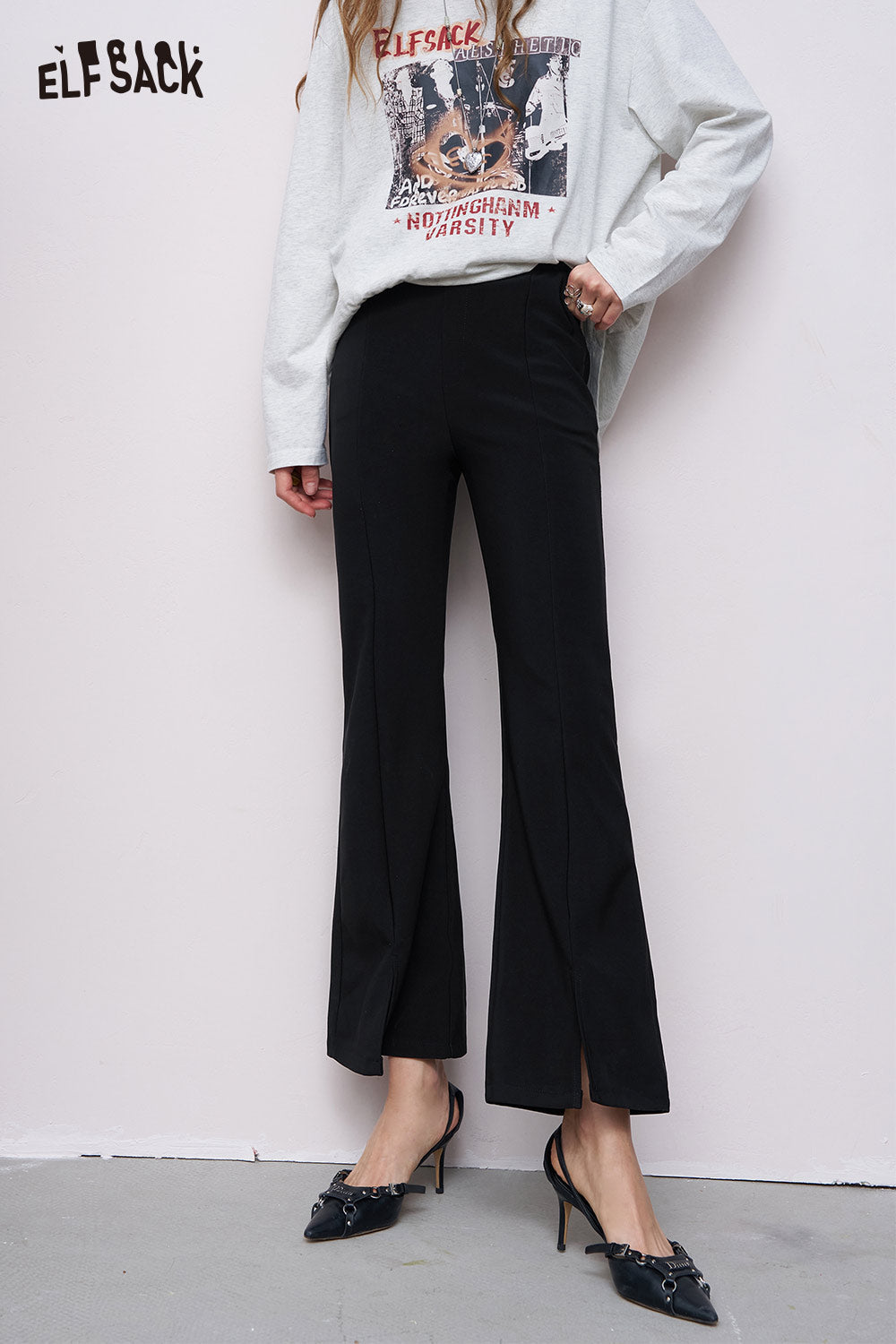 ELFSACK black women's ankle-length flared pants with front hem slit worn with sweatshirt and heels