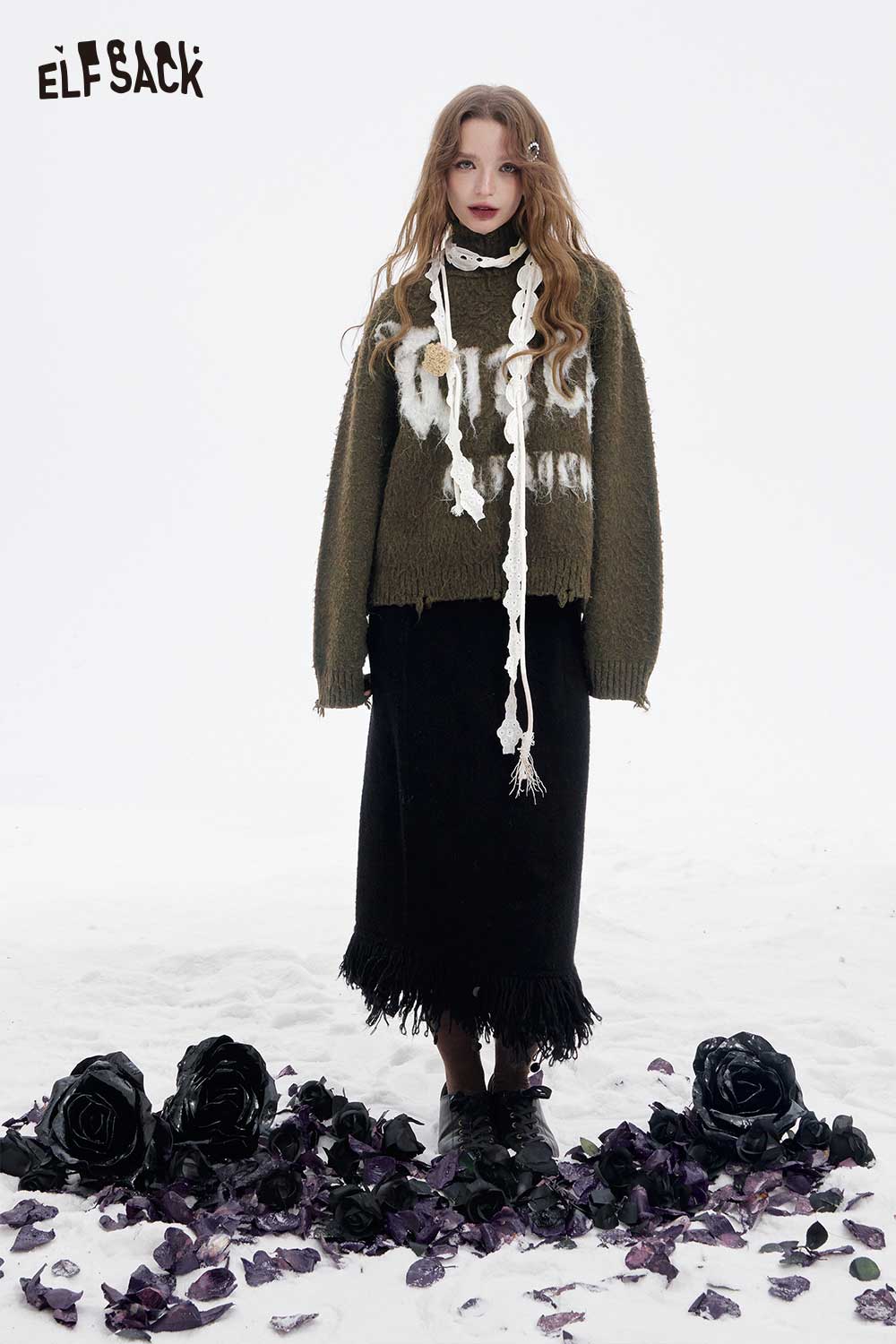 ELFSACK loose letter graphic fringe sweater styled with a black skirt among purple flowers