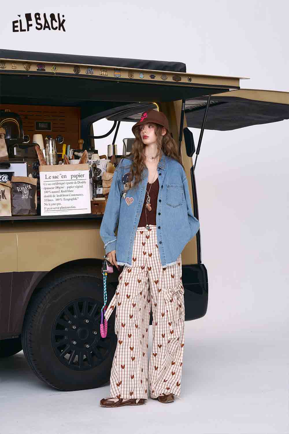 ELFSACK model wearing 3D mushroom denim shirt for women with wide leg printed pants and hat
