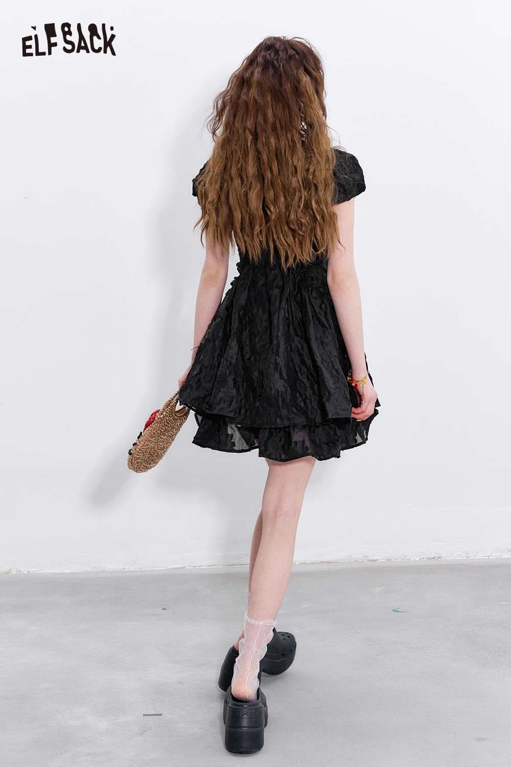 Back view of ELFSACK mandarin collar embroidered dress in black with flared skirt and short sleeves
