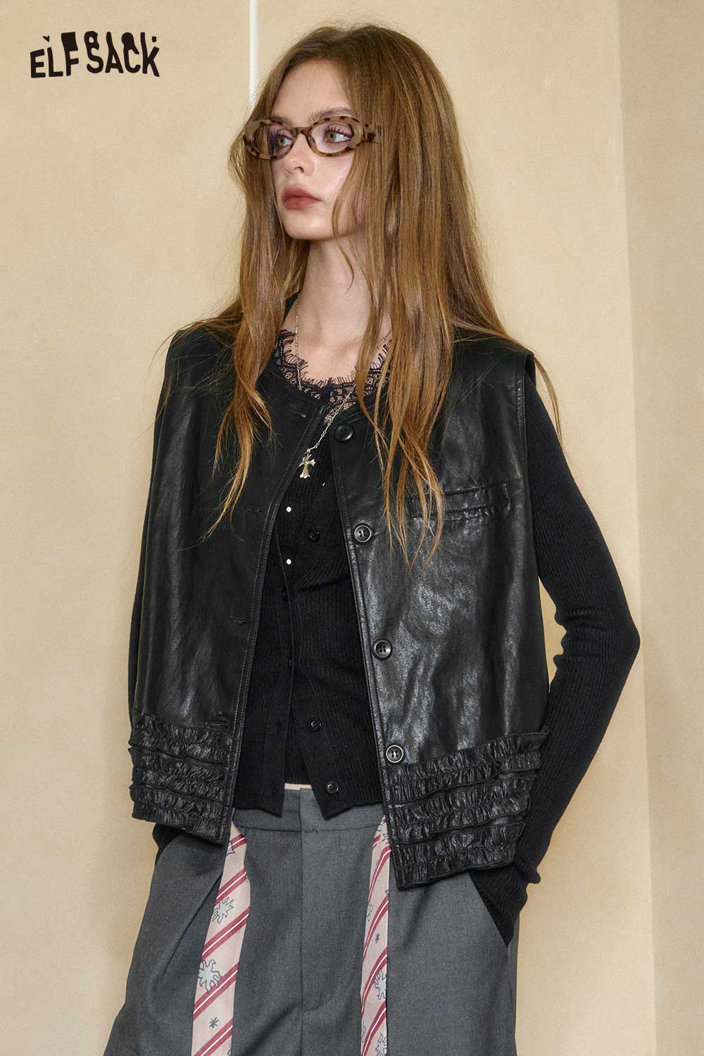 ELFSACK matte black PU leather sleeveless top with stylish button closure and textured detailing